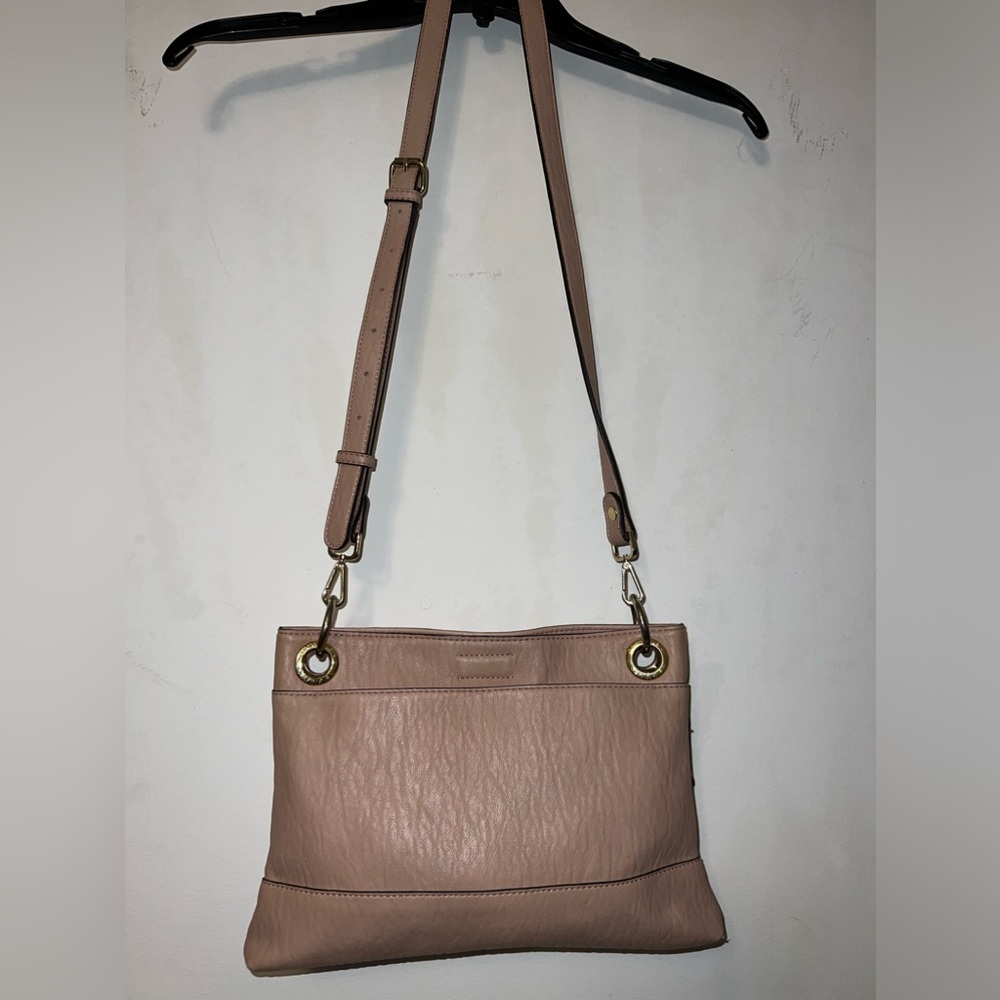 Calvin Klein light pink purse.  Many pockets.